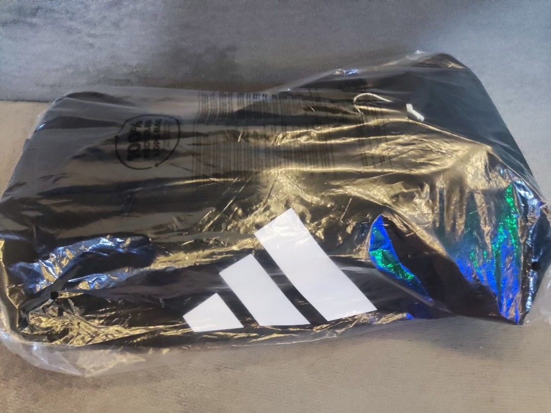 Adidas Training Duffel Bag Medium Black (Category: Sling Bags) located in Navotas City. Submitted by jhurram002 (Listing ID 1468405935, Image 3). Description: - Brand: Adidas - Color: Black with large white logo on the front - Size: Medium training duffel bag - Condition: Brand new with original store tags attached - Features: Sturdy shoulder strap with heavy-duty plastic clip and durable zippers for main compartment and side pocket srp: 2,900 no