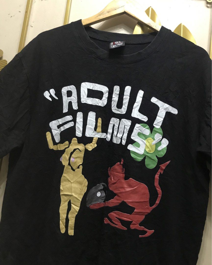 Adult Films Tee (Category: Tshirts & Polo Shirts ) located in Angeles City. Submitted by bashthriftstuff123 (Listing ID 1468403527, Image 2). Description: Adult Films Tee ( Giant Tag ) Size medium ( Boxy fit ) Width 23 Length 27 Verygood condi ₱320 + ship.
