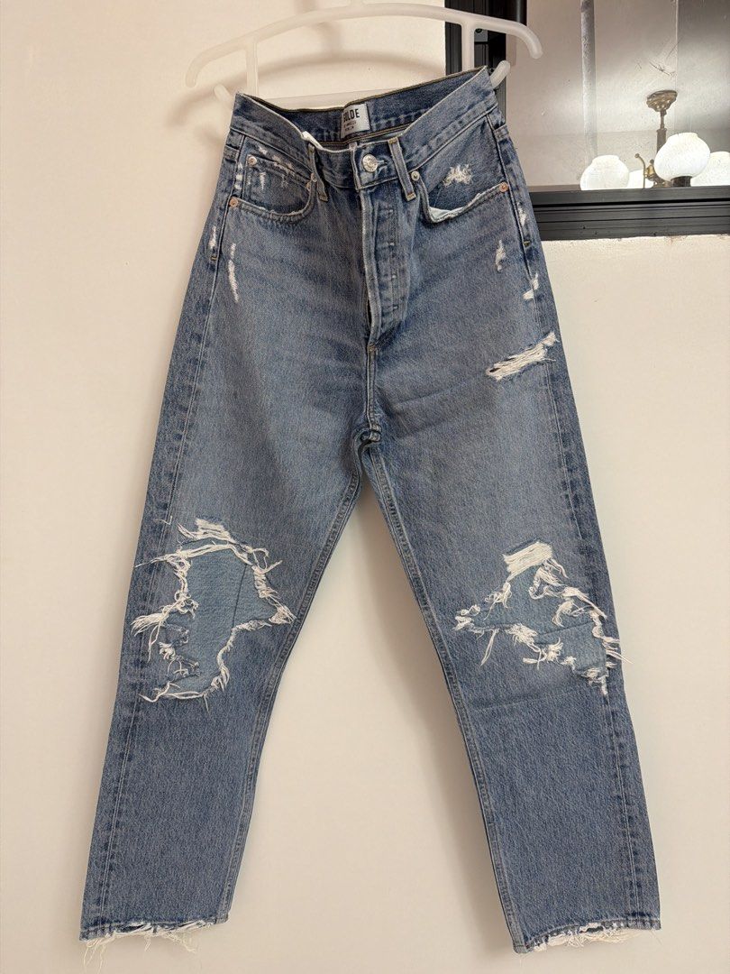 AGOLDE 90s Jean Distressed Light Wash Size 24 (Category: Jeans) located in Batangas. Submitted by luxuryinmyclowset (Listing ID 1468343612, Image 1). Description: - Brand: AGOLDE - Style: 90s Jean - Size: 24 (Waist measures ~14" across flat) - Wash: Classic light wash with knee, pocket, and hem distress - Rise: High-rise with button fly closure - Material: 100% Cotton, Made in USA - Fit: Great relaxed fit.