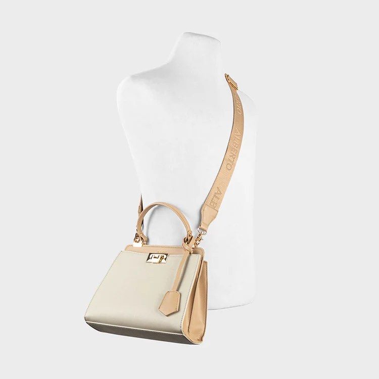 Alberto Cressa Prisma Two-Tone Structured Handbag with Shoulder Strap (Category: Cross-body Bags) located in Dasmarinas. Submitted by phia.aesi (Listing ID 1468325117, Image 3). Description: - Brand: Alberto - Color: Off-white and tan (Neutral, goes with everything) - Material: Structured faux leather with saffiano texture - Hardware: Gold-tone with front clasp closure - Straps: Top handle and adjustable branded shoulder strap - Condition: Like n