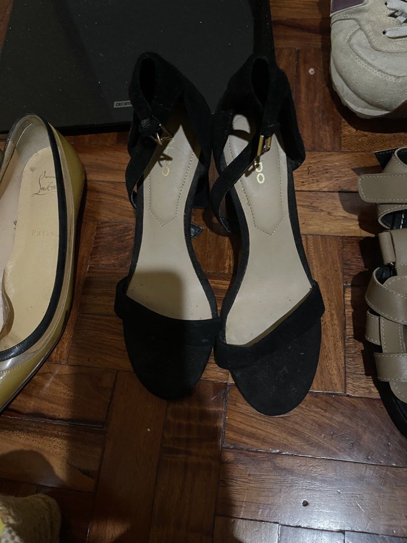 Aldo Black Suede Block Heel Sandals (Category: Heels) located in Manila. Submitted by evelyngrac95466 (Listing ID 1468323827, Image 1). Description: - Brand: Aldo - Color/Material: Black suede with neutral beige lining - Style: Chunky block heel, open toe, ankle strap with buckle closure - Details: Gold embossed logo on the inner sole - Condition: Minor signs of wear on the soles - Versatility: Classic wardrobe essential that pairs easily with va