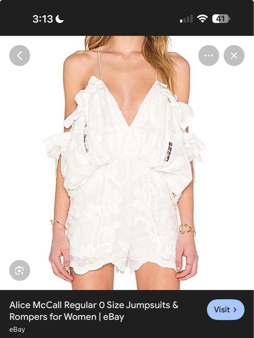 Alice McCall White Lace Romper Size AU 8 (Category: Rompers) located in Cebu City. Submitted by hotchkisscebu (Listing ID 1468341222, Image 2). Description: - Brand: Alice McCall - Item: White romper with floral embroidery and lace cutouts - Size: AUS 8 / USA 4 / EUR 36 - Design: Cold shoulder, short draped sleeves, scalloped hems, thin spaghetti straps, and halter-style back - Material: Lightweight cotton with back zip closure - Condition: Worn 