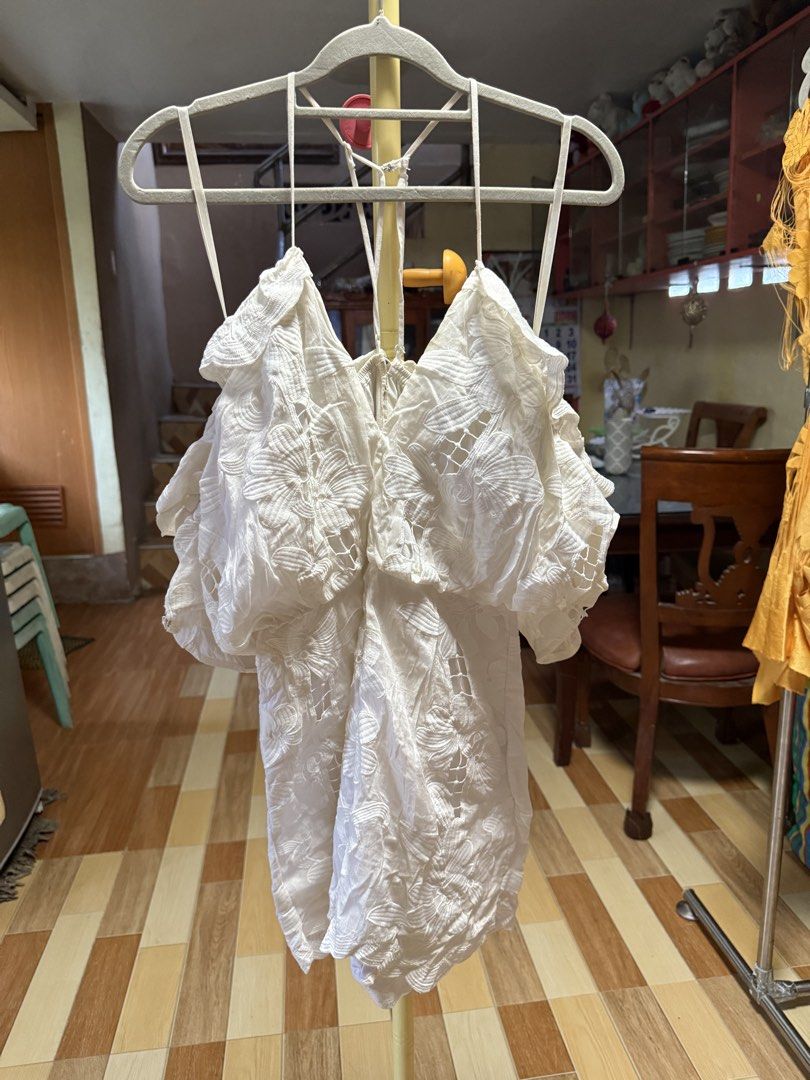 Alice McCall White Lace Romper Size AU 8 (Category: Rompers) located in Cebu City. Submitted by hotchkisscebu (Listing ID 1468341222, Image 1). Description: - Brand: Alice McCall - Item: White romper with floral embroidery and lace cutouts - Size: AUS 8 / USA 4 / EUR 36 - Design: Cold shoulder, short draped sleeves, scalloped hems, thin spaghetti straps, and halter-style back - Material: Lightweight cotton with back zip closure - Condition: Worn 