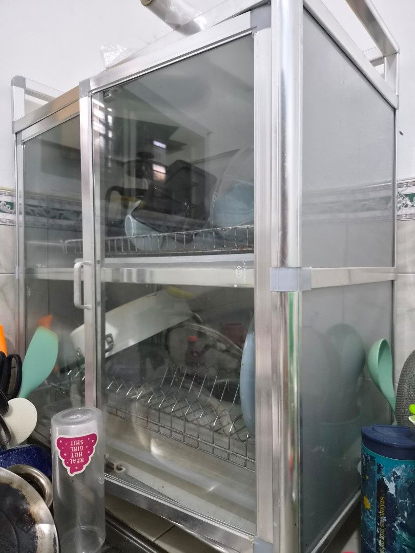 Aluminum double deck kitchen dish drying rack cabinet (Category: Food Organization & Storage) located in Taguig. Submitted by nowinowy (Listing ID 1468491089, Image 2). Description: - Aluminum and glass kitchen cabinet for drying and storing dishes - Two tiers inside with built-in wire racks for plates, bowls, and pot lids - Glass doors to keep your dinnerware dust-free - Sturdy metal frame construction Note: Overall, item is well maintained and 