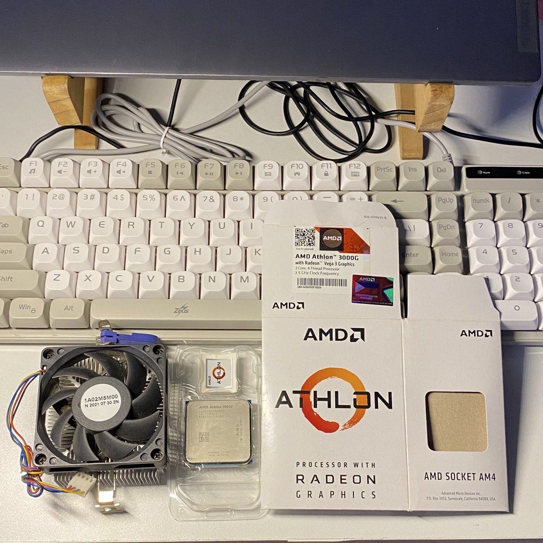 AMD Athlon 3000G Processor with Radeon Graphics AM4 (Category: Computer Parts) located in Quezon City. Submitted by hazelnutkofi (Listing ID 1468408298, Image 1). Description: - Model: AMD Athlon 3000G with Radeon Vega 3 Graphics - Specs: AM4 socket, 3.5 GHz, 2 cores, 4 threads - Inclusions: Original packaging box, plastic clamshell case, and stock cooler fan - Reason for selling: Upgraded rig, clearing out old parts.