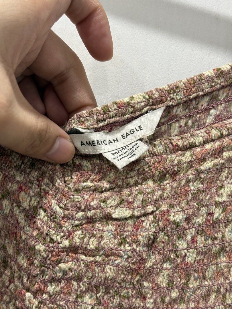 American Eagle Floral Long Sleeve Blouse Size M (Category: Longsleeves) located in Manila. Submitted by prelov3dbysteph (Listing ID 1468423343, Image 2). Description: - Brand: American Eagle - Size: Medium - Design: Pink floral print with white and green flowers - Details: Square neckline, smocked bodice, gathered front center - Sleeves: Long sleeves with ruffled shoulders and elasticated cuffs - Fit: Flowy, relaxed fit at the hem - Origin: Made 