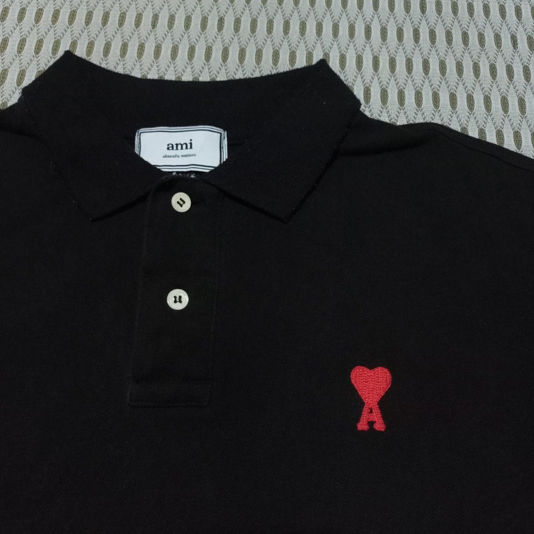 Ami Paris Black Polo Shirt (Category: Tshirts & Polo Shirts ) located in General Santos City (Dadiangas). Submitted by collection_9500 (Listing ID 1468499641, Image 2). Description: Ami Paris Black Polo Shirt 22.5 x 26 Large Excellent, minimal lints collar Gensan loc Pm for inquiries All are thrifted items.