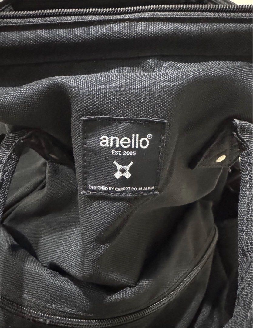 Anello Black Backpack Repreve Eco-Friendly Material (Category: Backpacks) located in Manila. Submitted by me.declut (Listing ID 1468460167, Image 3). Description: - Brand: Anello - Material: Eco-friendly Repreve recycled canvas - Color: Classic Black - Compartments: Secure main zipped compartment and front zipped pocket - Interior: Built-in laptop sleeve with velcro strap plus extra slip pockets - Carry Options: Dual top carry handles and adjusta