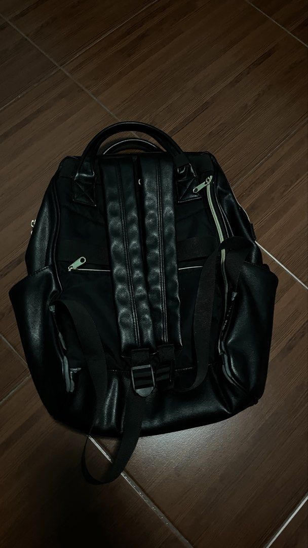 anello black faux leather backpack (Category: Backpacks) located in Manila. Submitted by cansitcanton (Listing ID 1468419133, Image 2). Description: - Brand: anello - Material: Premium black faux leather with clean surface and minimal wear - Comfort: Fabric backing with adjustable padded shoulder straps and structured top handles - Pockets: Secure main compartment with top zipper entry + front zipper pocket with chic silver hardware - Condition: 