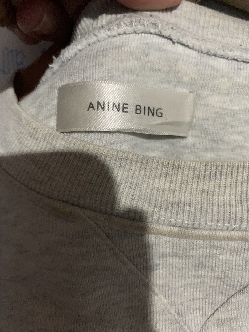 Anine Bing Graphic Sweatshirt Grey Size S (Category: Longsleeves) located in Naga. Submitted by than09070539101 (Listing ID 1468463046, Image 2). Description: - Brand: Anine Bing - Size: S - Material: 100% cotton for ultimate comfort - Design: Large photographic graphic print of a woman's face on the front - Details: Classic crew neck with V-stitch at the collar - Finish: Ribbed cuffs and hem - Condition: Excellent/Worn with care - Perfect for ca