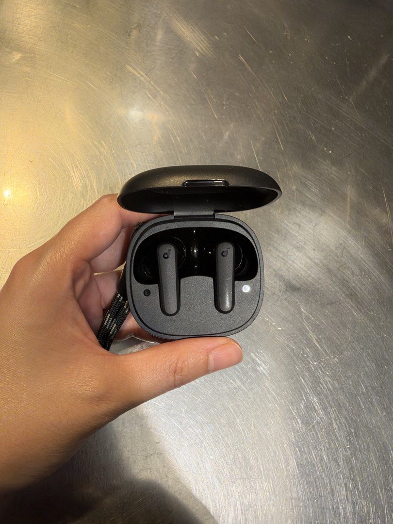 Anker Soundcore R50i True Wireless Earbuds Black (Category: Earphones) located in Manila. Submitted by garagesalebykoda (Listing ID 1468432136, Image 2). Description: Only worn once on ears to test if it worked. Never used after that, cleaned it as well. - Model: Anker Soundcore R50i True Wireless Earbuds - Color: Classic Black - Inclusions: Both earbuds, charging case, and attached lanyard strap - Key Features: Compact pocket-sized design, clear