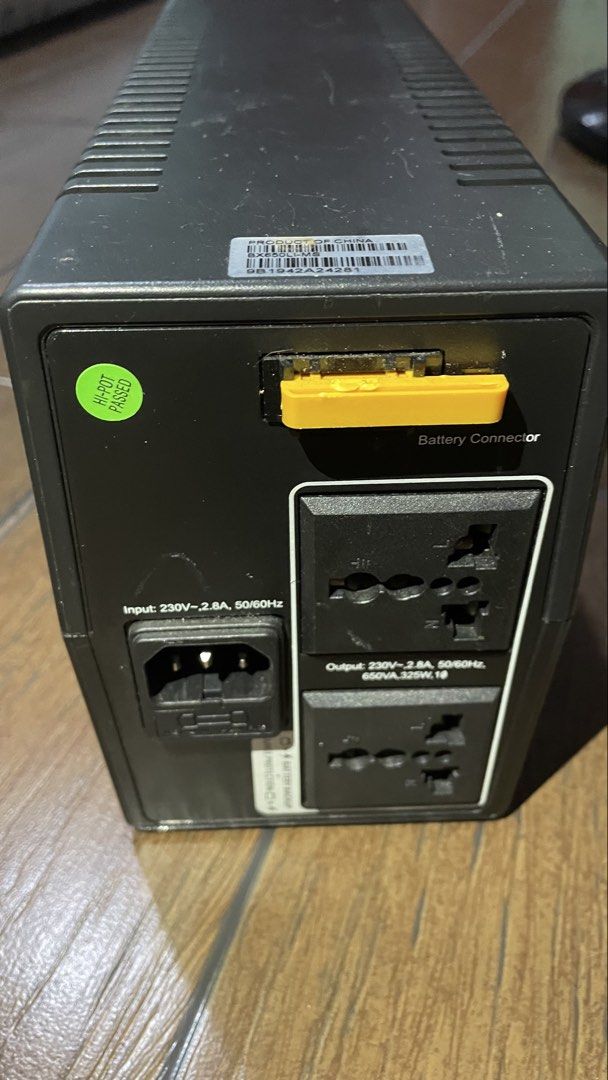 APC Back-UPS 650 Uninterruptible Power Supply (Category: Electrical, Adaptors & Sockets) located in Antipolo. Submitted by tatayjq (Listing ID 1468299314, Image 2). Description: - Model: APC Back-UPS 650 (BX650LI-MS) - Capacity: 650VA / 325W (230V input/output) - Features: Universal outlets and yellow battery connector slot at the back - Condition: Unit is fully working, green power light turns on normally; minor scuffs and dust on the black casi