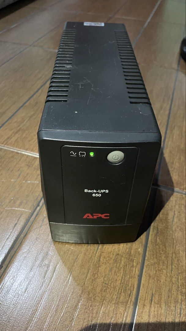 APC Back-UPS 650 Uninterruptible Power Supply (Category: Electrical, Adaptors & Sockets) located in Antipolo. Submitted by tatayjq (Listing ID 1468299314, Image 1). Description: - Model: APC Back-UPS 650 (BX650LI-MS) - Capacity: 650VA / 325W (230V input/output) - Features: Universal outlets and yellow battery connector slot at the back - Condition: Unit is fully working, green power light turns on normally; minor scuffs and dust on the black casi