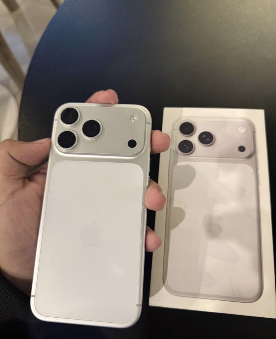 Apple iPhone 17 Pro Max 256GB Silver (Category: iPhone 17 Series) located in Iloilo. Submitted by heco2k1999542 (Listing ID 1468395123, Image 3). Description: IPhone 17 Pro Max in silver with 256GB storage capacity. Includes original retail box. Model number MFYM4X/A, serial number JPDCXPV7HK. Limited warranty active until September 30, 2027. Clean exterior, USB-C port at the bottom, triple camera setup on the rear. Fully functional device runnin