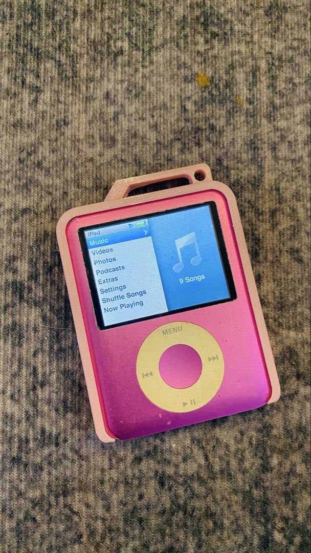 Apple iPod Nano 3rd Gen 8GB Pink (Category: Portable Music Players) located in Dasmarinas. Submitted by bbgaminghub (Listing ID 1468319685, Image 1). Description: - Model: iPod Nano 3rd Generation (Square screen with click wheel) - Capacity: 8GB - Color: Pink - Condition: Fully functional, good battery life, clear screen, with normal scuffs on the chrome back from use - Inclusions: High Quality 3D print protective case with a top loop.