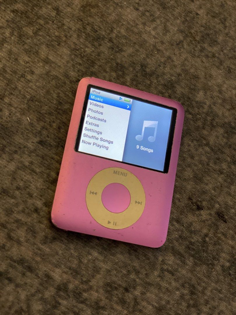 Apple iPod Nano 3rd Gen 8GB Pink (Category: Portable Music Players) located in Dasmarinas. Submitted by bbgaminghub (Listing ID 1468319685, Image 3). Description: - Model: iPod Nano 3rd Generation (Square screen with click wheel) - Capacity: 8GB - Color: Pink - Condition: Fully functional, good battery life, clear screen, with normal scuffs on the chrome back from use - Inclusions: High Quality 3D print protective case with a top loop.