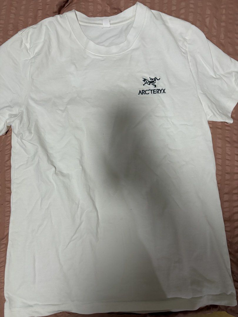 Arc'teryx White T-Shirt (Category: Shirts) located in Quezon City. Submitted by bluefrenchorn (Listing ID 1468424971, Image 1). Description: - Brand: Arc'teryx - Color: White - Design: Minimalist with small embroidered chest logo, crew neck, and short sleeves - Material: Lightweight, breathable cotton - Condition: Clean, excellent daily wear piece - Measurements: Pit to pit ~17 inches, Length ~24 inches.