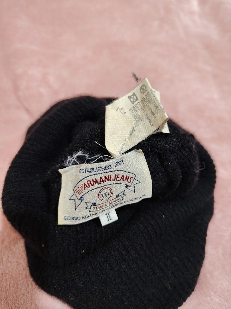 Armani Jeans Black Wool Beanie Hat (Category: Beanies) located in Villasis. Submitted by trip_thrift15 (Listing ID 1468392317, Image 3). Description: - Brand: Armani Jeans - Color: Classic Black - Size: II - Design: White embroidered logo lettering and eagle detail on front cuff - Material: 80% Wool, 20% Nylon - Origin: Made in Italy - Care: Hand wash only - Condition: Excellent winter accessory MOP-GCASH/MAYA JNT COURIER PRICE+SF.