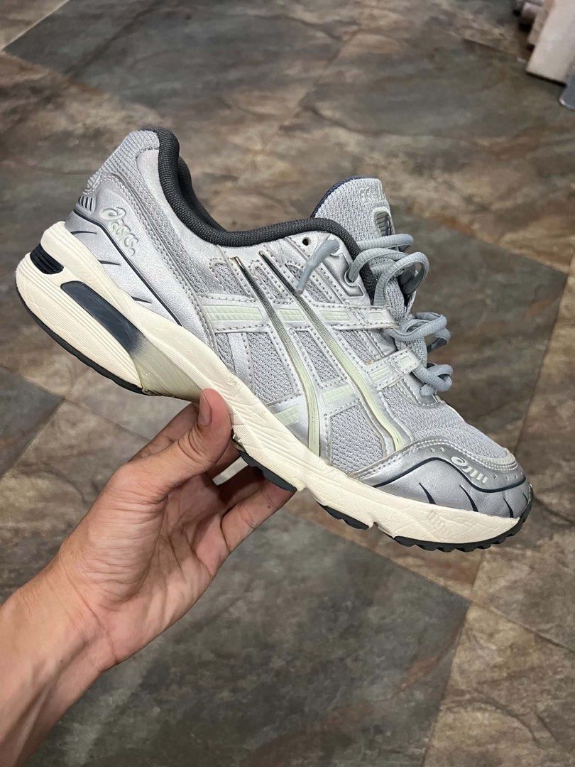 Asics Gel-1130 Silver Grey Sneakers (Category: Sneakers) located in Bacolod City. Submitted by novymaesel14868 (Listing ID 1468409664, Image 2). Description: - Model: Asics Gel-1130 - Color: Metallic Silver and Grey - Material: Classic mesh upper with synthetic overlays - Comfort: Cushioned sole with GEL technology in the heel - Details: Dark grey laces and inner lining - Condition: Great everyday rotation pair with minimal wear on treads.