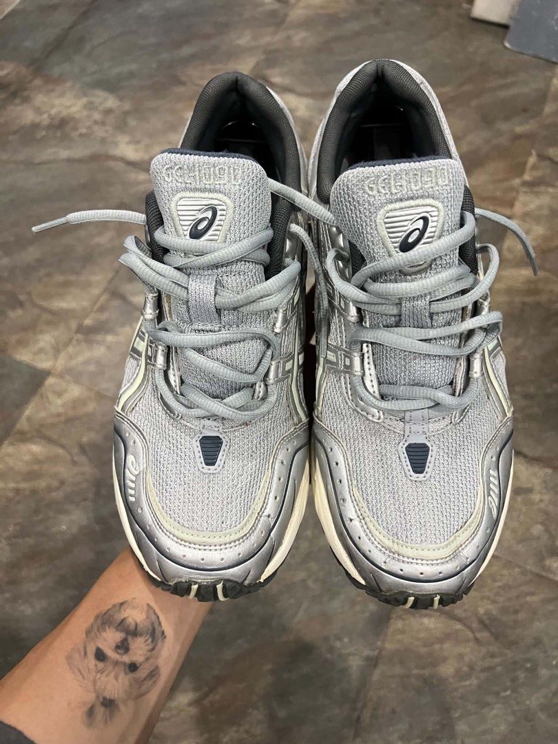Asics Gel-1130 Silver Grey Sneakers (Category: Sneakers) located in Bacolod City. Submitted by novymaesel14868 (Listing ID 1468409664, Image 3). Description: - Model: Asics Gel-1130 - Color: Metallic Silver and Grey - Material: Classic mesh upper with synthetic overlays - Comfort: Cushioned sole with GEL technology in the heel - Details: Dark grey laces and inner lining - Condition: Great everyday rotation pair with minimal wear on treads.