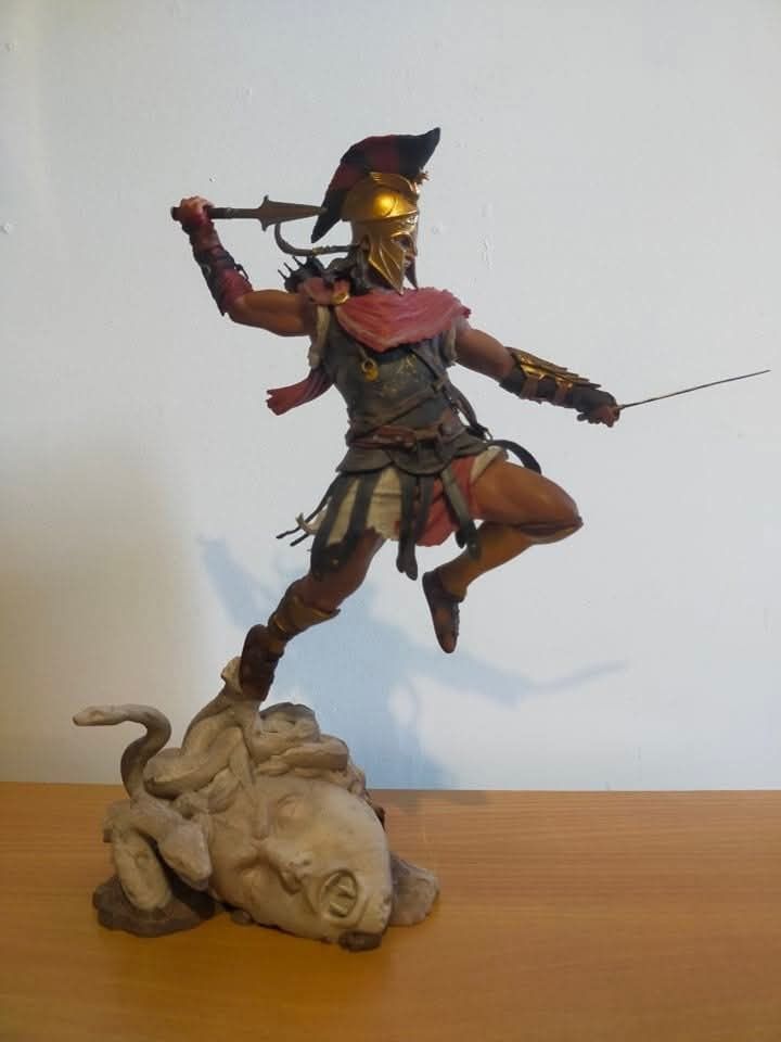 Assassin's Creed Odyssey Alexios Statue Figure (Category: Figurines & Statues) located in Muntinlupa City. Submitted by lazoftoys (Listing ID 1468284380, Image 1). Description: - no box - no issue and mint condition - Authentic Assassin's Creed Odyssey Alexios statue - Dynamic pose leaping off a detailed Medusa head stone base - Equipped with gold Spartan helmet, red cape, armor, and weapons - Highly detailed sculpt, perfect for gaming fans and c