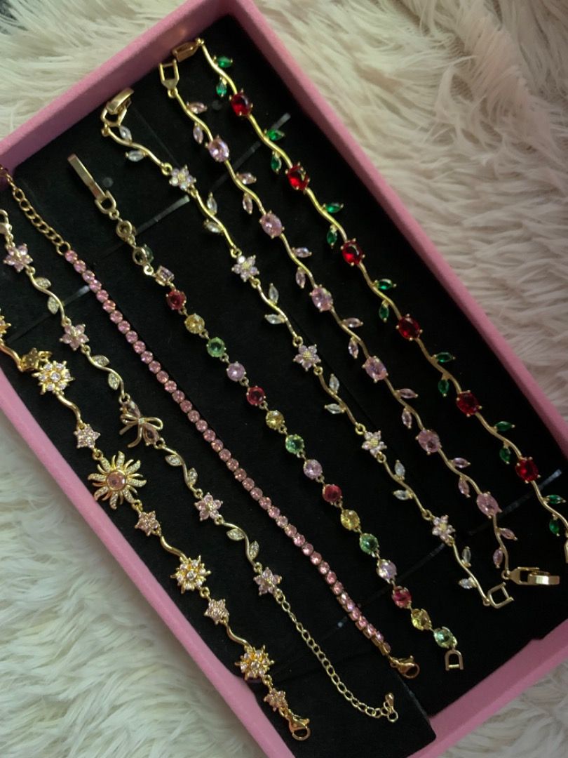 Assorted Aesthetic Fashion Bracelets (Category: Bracelets) located in Iloilo. Submitted by silenthawk.18becb (Listing ID 1468307893, Image 1). Description: - Collection of cute fashion bracelets in various designs and colors - Features floral vines, colorful crystals, pink tennis style, and sun motifs - Elegant gold-tone chains - Mix and match easily for different outfits - Great for daily wear or as a gift for loved ones.