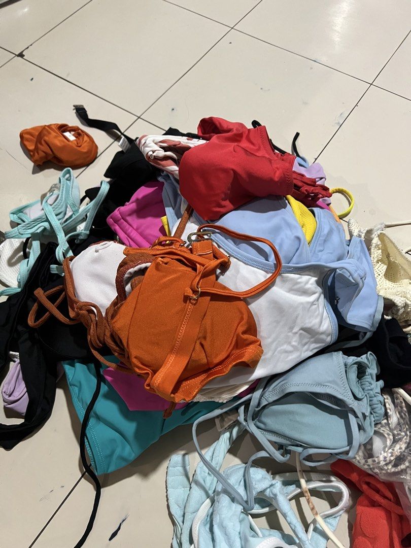Assorted Bikini Swimsuit Swimwear Bundle (Category: Bikinis & Swimsuits) located in Manila. Submitted by justlooking4clothes (Listing ID 1468463647, Image 1). Description: - Assorted bundle of swimsuits and bikini tops - Mixed vibrant colors: orange, red, blue, pink, black, white, and teal - Various styles featuring adjustable straps and ties - Perfect mix for beach trips and pool days - Sold as a whole lot.