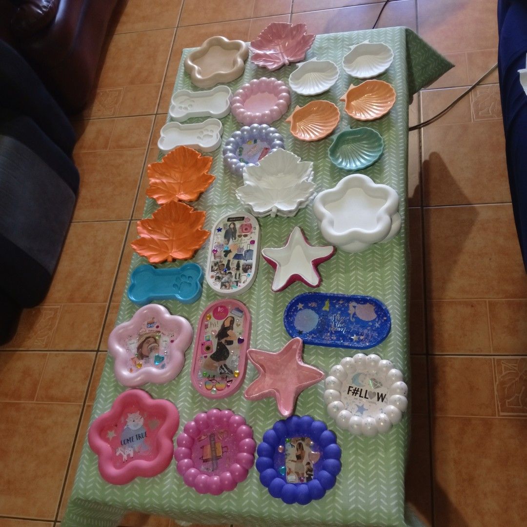 Assorted Decorative Resin Trays and Dish Collection (Category: Dinnerware & Cutlery) located in Las Pinas. Submitted by deehlilah (Listing ID 1468309790, Image 3). Description: - Handmade resin & ceramic trinket trays, dishes, and plates - Available shapes: Starfish, leaves, dog bones, flowers, and photo frames - Beautiful glossy finishes featuring glitter, stickers, and decorative inserts - Perfect catch-all for jewelry, keys, and small accessor