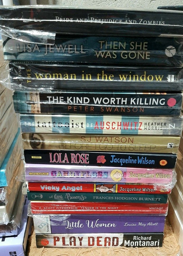 Assorted Fiction and Classic Novels Book Bundle (Category: Storybooks) located in Manila. Submitted by ayireads (Listing ID 1468395305, Image 2). Description: - Massive stack of fiction novels and classic literature - Authors include Charles Dickens, Dan Brown, Jodi Picoult, Jacqueline Wilson, Jane Austen, and Khaled Hosseini - Mostly paperback editions - Many books are still wrapped in plastic protection - Genres include thrillers, romance, cont