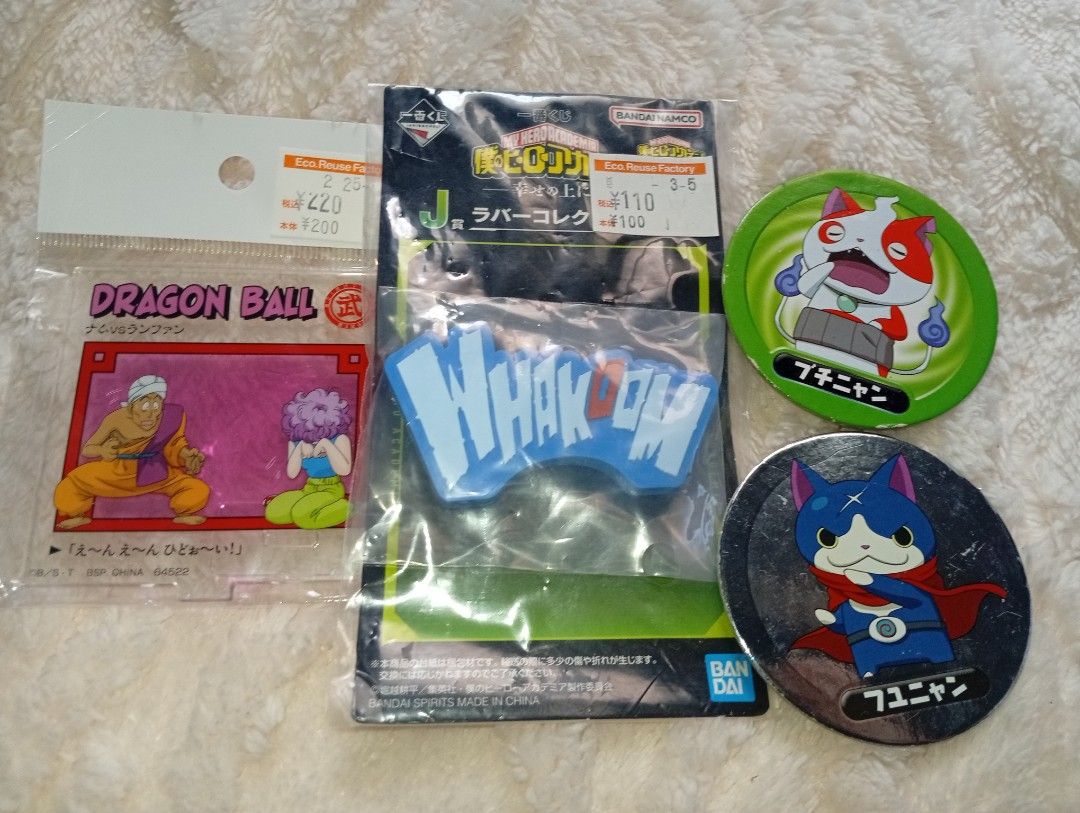 Take all assorted keychain, standee and merch set/bundle (Category: Other Merchandise) located in Tarlac. Submitted by kaizer_rabbit (Listing ID 1468434969, Image 1). Description: 1.Dragon Ball Ichiban Kuji "Dragon History" E Prize Acrylic Stand (featuring Nam vs. Ranfan) 2.My Hero Academia Ichiban Kuji "On Top of Happiness" J Prize Rubber Collection (featuring a "WHAKOOM" onomatopoeia sound effect design) 3.Yo-kai Watch Suntory Collaboration Min