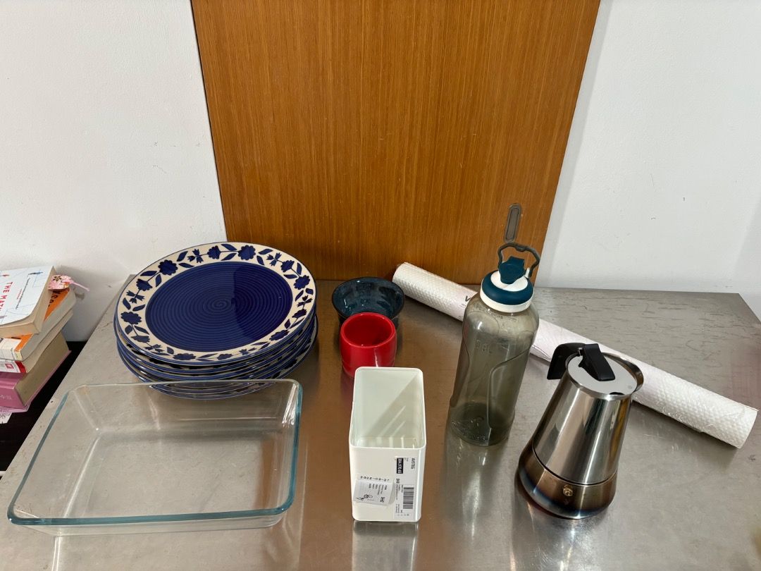 Assorted kitchen items (Category: Water Bottles & Tumblers) located in Singapore. Submitted by princessrunner (Listing ID 1468335169, Image 1). Description: Price negotiable - depending on how many items you take - SMU embossed logo tumbler (never used) - Oven mitt (lightly used) - 6 Plates from handicraft store (never used) - Oven glass tray (lightly used) - Moka pot (heavily used, for gas burner only) - 2 Handmade cups - 1 Decathlon water bottl