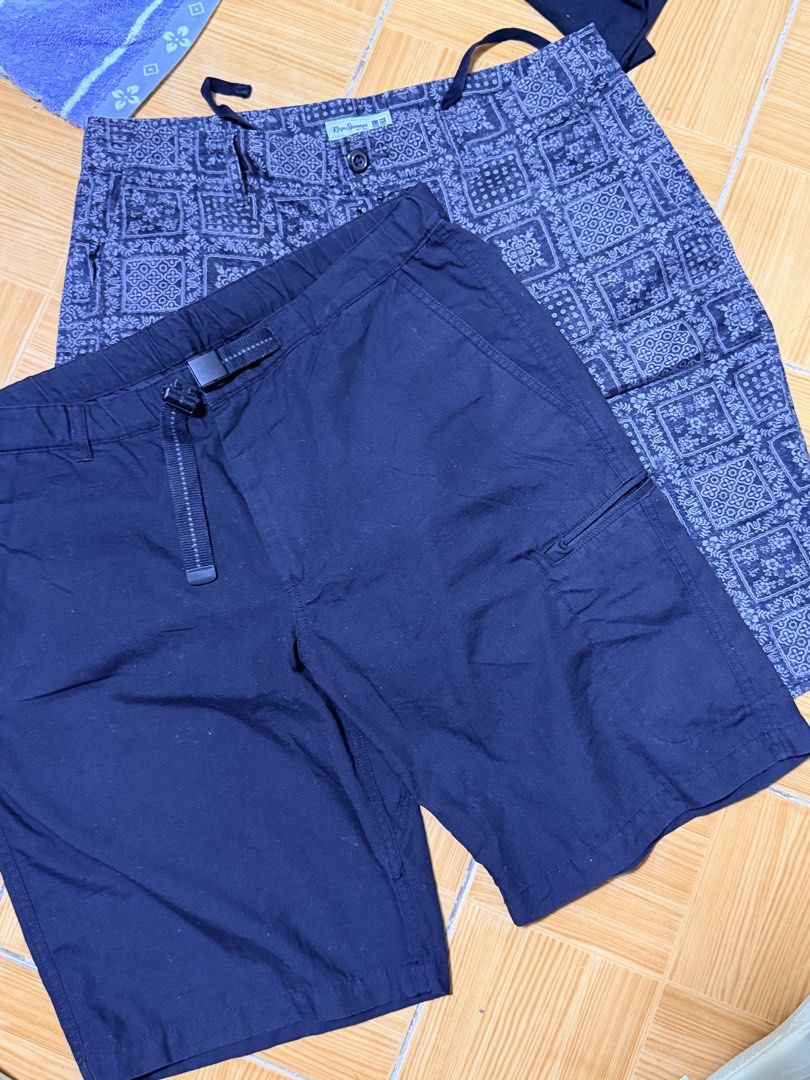 Assorted Men's Shorts Bundle Volcom Uniqlo Brands (Category: Shorts) located in Paete. Submitted by skydruemadison (Listing ID 1468302512, Image 3). Description: Bundle of men's shorts in various patterns and solid colors. Includes styles from Volcom and Uniqlo. Sizes include 32 and LL with adjustable waistbands or drawstrings. Variety of prints like plaid, tropical palm trees, and bandanas. Multiple utility pockets included on select pairs. Grea