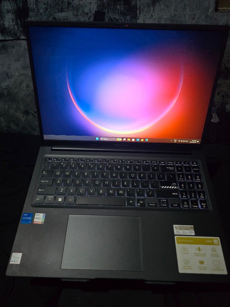 ASUS Vivobook Intel Core i5 12th Laptop (Category: Laptops & Notebooks) located in Cavite. Submitted by s_o.l (Listing ID 1468295449, Image 2). Description: - Brand: ASUS Vivobook - Color: Sleek black with prominent li - Processor: Intel Core i5 with integrated graphics - OS: Windows - Usability: Full-size keyboard with numeric keypad and large trackpad - Display: Decent screen size ideal for work and daily tasks - Condition: Ready for a new owne