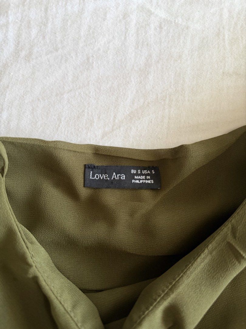 asymmetrical olive green mini dress (Category: Dresses) located in Cabanatuan. Submitted by brokegirlwholovesclothes (Listing ID 1468471126, Image 3). Description: - size S (can fit XS) - waist up to 26" - adjustable straps, unsure how to measure the dress but on me, shortest part is 27-28" - so pretty, can be worn as a top too! has 2 very small unnoticeable dot stains (see last 2 photos) .