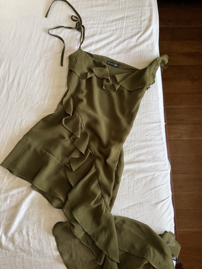 asymmetrical olive green mini dress (Category: Dresses) located in Cabanatuan. Submitted by brokegirlwholovesclothes (Listing ID 1468471126, Image 2). Description: - size S (can fit XS) - waist up to 26" - adjustable straps, unsure how to measure the dress but on me, shortest part is 27-28" - so pretty, can be worn as a top too! has 2 very small unnoticeable dot stains (see last 2 photos) .
