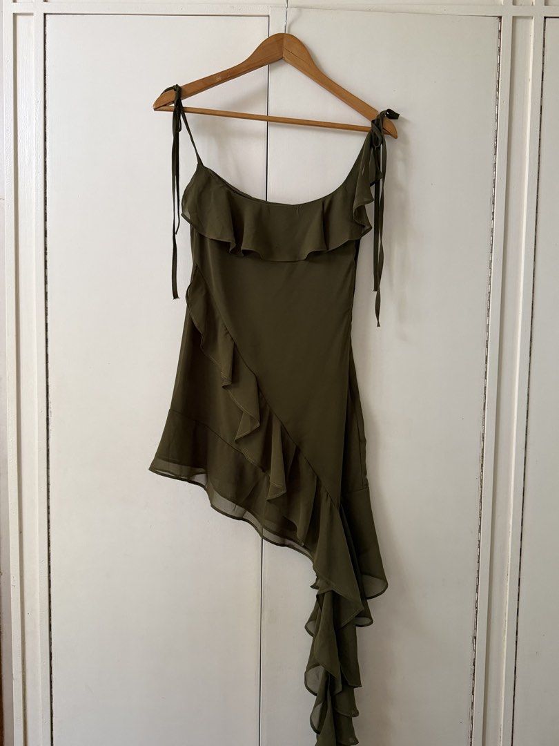 asymmetrical olive green mini dress (Category: Dresses) located in Cabanatuan. Submitted by brokegirlwholovesclothes (Listing ID 1468471126, Image 1). Description: - size S (can fit XS) - waist up to 26" - adjustable straps, unsure how to measure the dress but on me, shortest part is 27-28" - so pretty, can be worn as a top too! has 2 very small unnoticeable dot stains (see last 2 photos) .