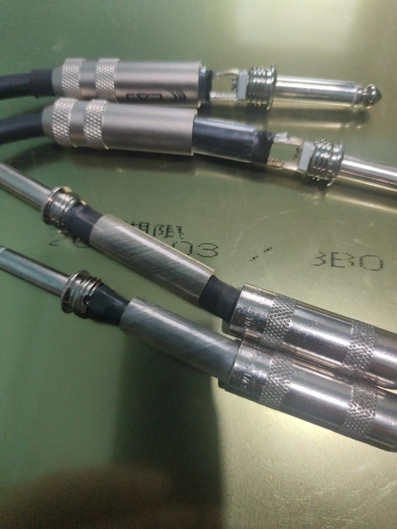 Audio Cables with 1/4 Inch Jack Connectors (Category: Cables & Adaptors) located in Manila. Submitted by wuxue998 (Listing ID 1468357365, Image 3). Description: - Type: Standard 1/4" mono jack audio cables - Build: Includes screw-on metal barrels and transparent heat shrink tubing for strain relief - Condition: Some outer barrels are unscrewed to show internal wiring/solder points (sold as pictured) - Best For: DIY audio setups, musical instrumen
