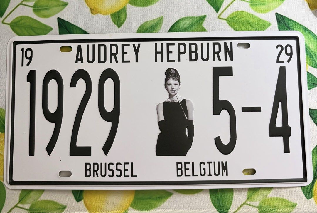 Audrey Hepburn Decorative License Plate (Category: Vintage Collectibles) located in Quezon City. Submitted by tflquezoncity (Listing ID 1468419532, Image 1). Description: ❤️ Audrey Hepburn Collectible 😍 ❤️ Mint condition 10/10 ❤️ Sturdy metal construction with embossed lettering and graphics ❤️ Standard 12 inches by 6 inches ❤️ Installation: Convenient pre-drilled mounting holes in the top and bottom corners ❤️ Back: Vintage-y silver back surfac