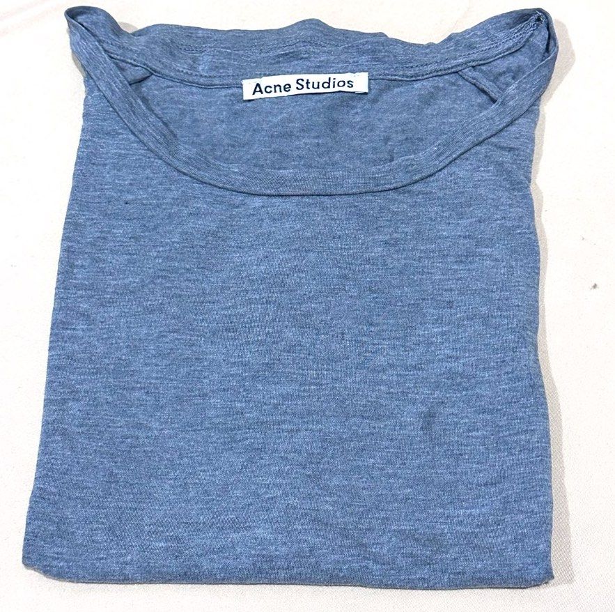 Authentic Acne Studios “Nairobi” Draped Basics T-Shirt (Grey) (Category: Shirts) located in Antipolo. Submitted by shopaho_nique (Listing ID 1468282168, Image 1). Description: Authentic Acne Studios “Nairobi” Draped Basics T-Shirt (Grey) Size: XS (Fits relaxed/fluid silhouette) Approx. L: 23 inches Pit to pit : 20 inches Description: Authentic archival Acne Studios “Nairobi” T-Shirt in Grey Melange. Unlike basic cotton tees, this specific model i