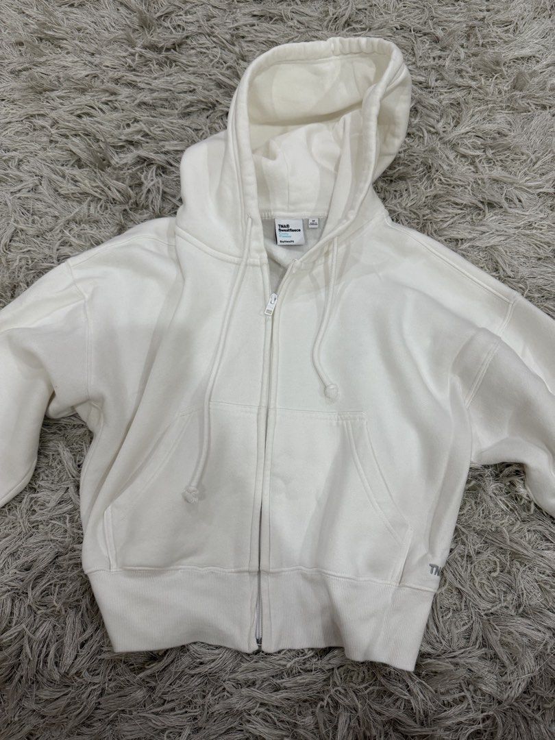 Authentic Aritzia TNA Zip Up Jacket (Category: Coats, Jackets and Outerwear) located in Quezon City. Submitted by emily_in_pariss (Listing ID 1468369976, Image 1). Description: Has small stain but can be laundried! Purchased for 4k in Canada Fits Small-Medium!.
