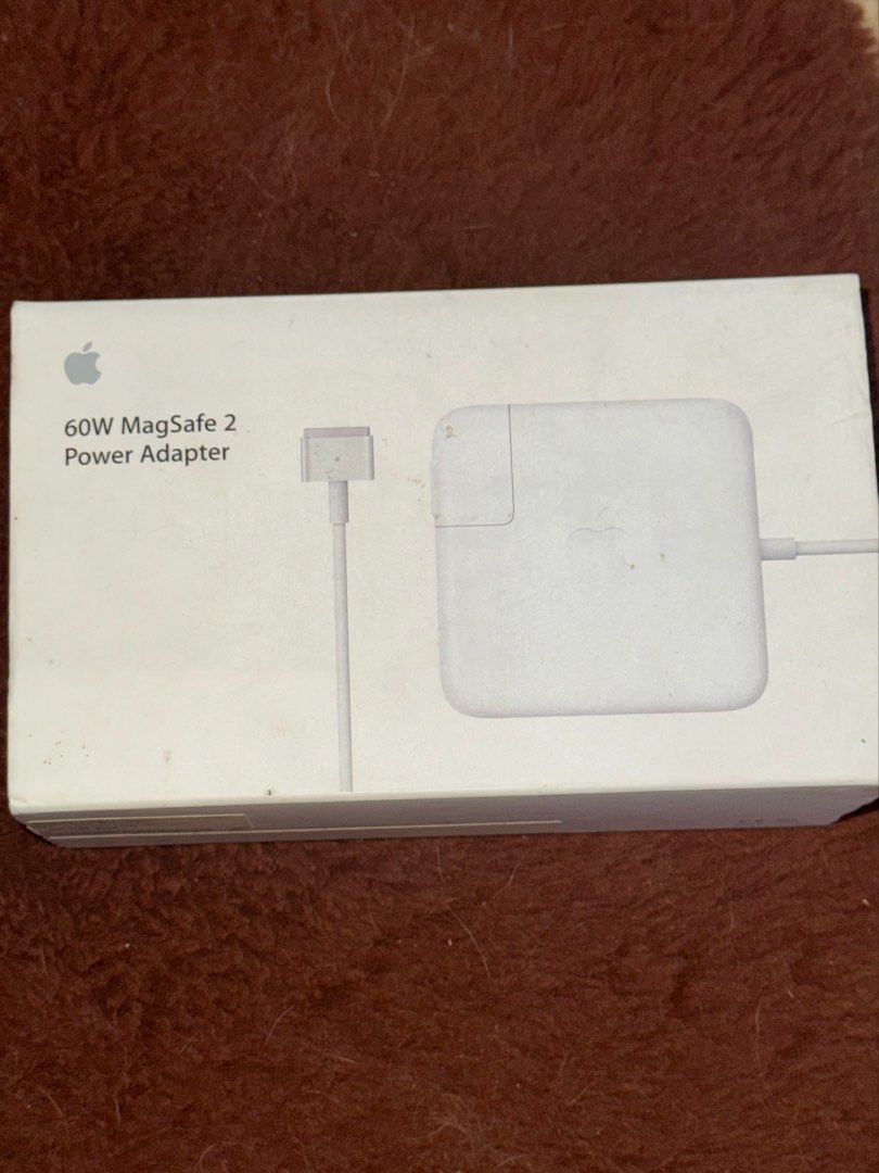 AUTHENTIC MACBOOK CHARGER (60W MAGSAFE 2 POWER ADAPTOR) (Category: Chargers) located in Batangas. Submitted by bel_m24 (Listing ID 1468289086, Image 1). Description: PLS BUY AT YOUR OWN RISK. This charger has never been used. It was purchased in Saudi Arabia years ago, so there is no receipt. Unfortunately, the MacBook broke before we could test whether the charger was working. COMPATIBLE: - MacBook Pro Models (13-inch Retina) - MacBook Pro (Reti