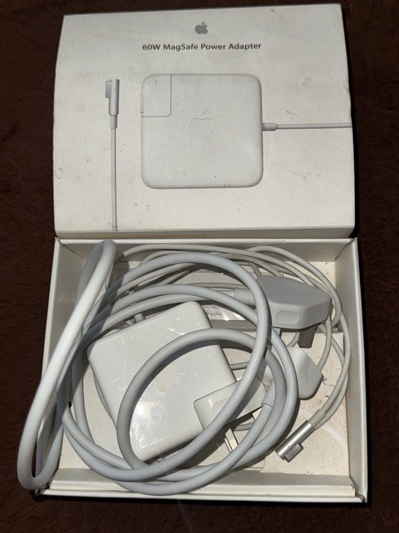 AUTHENTIC MACBOOK CHARGER (60W MAGSAFE POWER ADAPTOR) (Category: Chargers) located in Batangas. Submitted by bel_m24 (Listing ID 1468289931, Image 2). Description: PLS BUT AT YOUR OWN RISK. This charger has never been used since our MacBook Pro was already old and we weren't able to use it. COMPATIBLE: Compatible MacBook Pro Models (13-inch Non-Retina) - MacBook Pro (13-inch, Mid 2012) (Model A1278) - MacBook Pro (13-inch, Late 2011 / Early 2011)