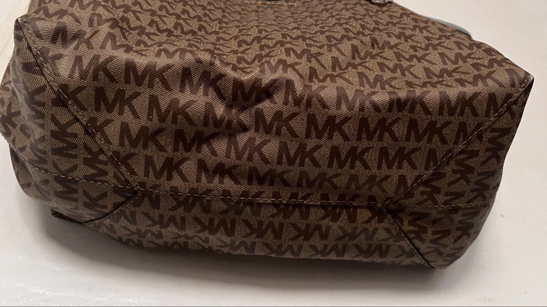 Authentic Michael Kors Tote Bag Brown Blue (Category: Tote Bags) located in Manila. Submitted by prelovedpick.com (Listing ID 1468292591, Image 2). Description: DECLUTTERING ‼️ FIXED PRICE - Authentic Michael Kors canvas tote bag with all-over MK monogram print - Elegant light blue leather straps and top trim - Premium gold-tone hardware, including front logo lettering and strap charm ring - Roomy interior compartment for your daily essentials - 