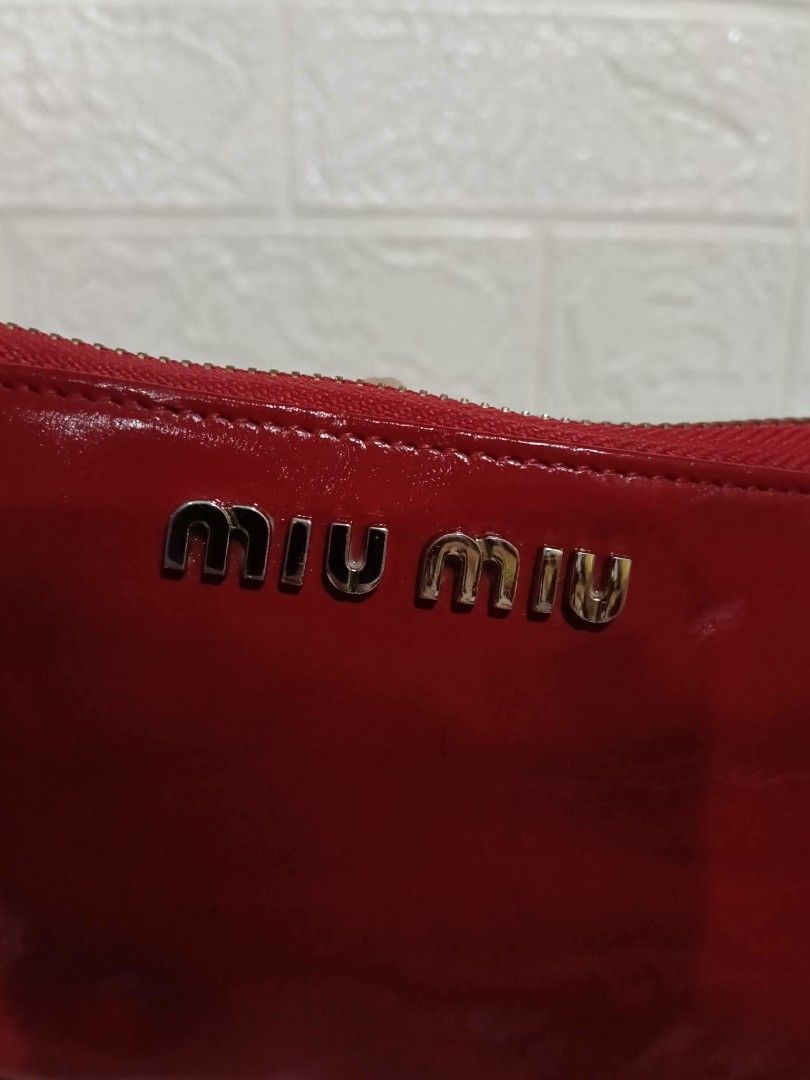 Authentic MIU MIU Patent Leather Wallet (Category: Luxury Bags & Wallets) located in Manila. Submitted by archie_doroy (Listing ID 1468335329, Image 3). Description: Authentic MIU MIU Long Wallet in good condition 💯 Rank AB 750 Freeship.