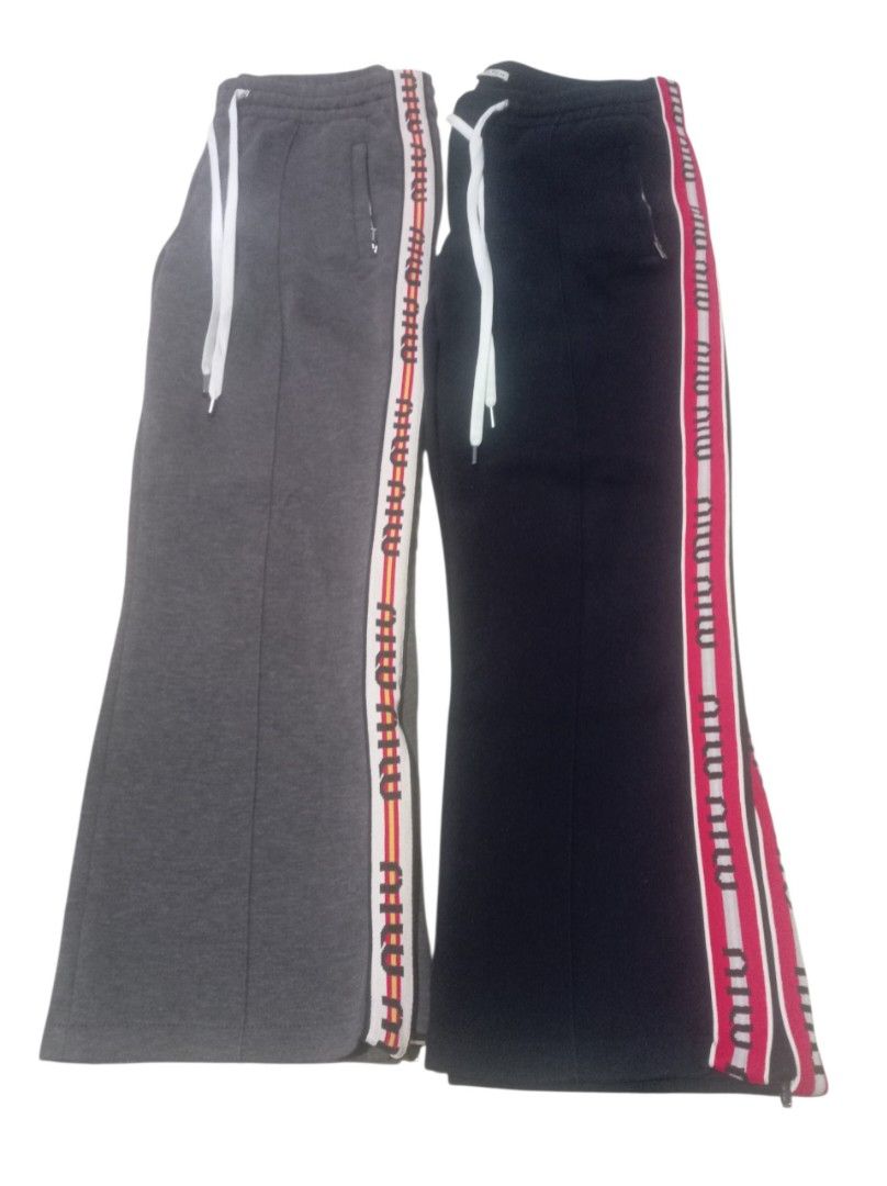 Authentic💯 MiuMiu 2pcs Jogger (Category: Luxury Apparel) located in Tagum. Submitted by maryjanepradalux (Listing ID 1468318090, Image 1). Description: Bundle of 2 authentic Miu Miu sweatpants in size 44 (Grey & Black). Made in Italy with cozy fleece, drawstring waist, zip pockets, and stylish logo side stripes. Super comfy and chic! Pm for more details .
