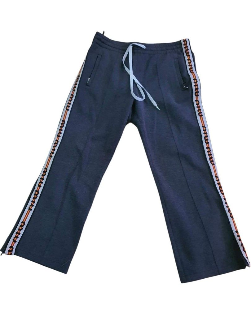 Authentic💯 MiuMiu 2pcs Jogger (Category: Luxury Apparel) located in Tagum. Submitted by maryjanepradalux (Listing ID 1468318090, Image 3). Description: Bundle of 2 authentic Miu Miu sweatpants in size 44 (Grey & Black). Made in Italy with cozy fleece, drawstring waist, zip pockets, and stylish logo side stripes. Super comfy and chic! Pm for more details .