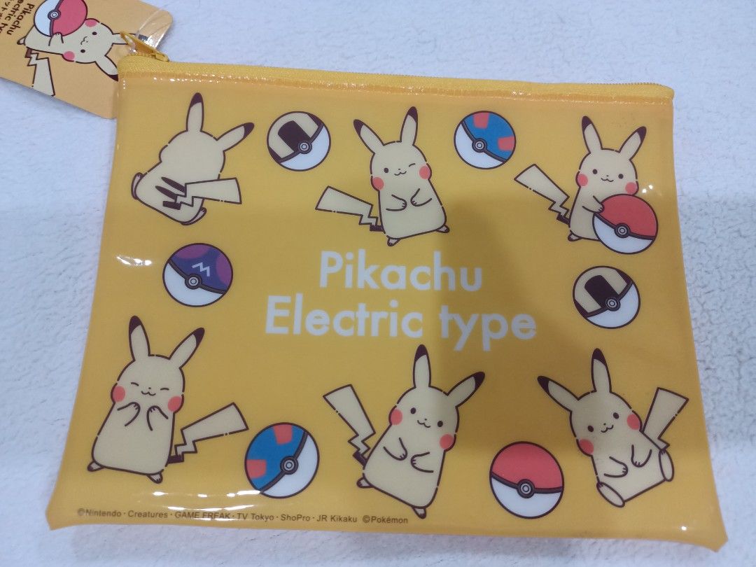 Authentic Pokemon Pikachu Flat Vinyl Zipper Pouch (Category: Character Goods) located in Manila. Submitted by jollynest24 (Listing ID 1468443004, Image 2). Description: - Authentic Pokemon and Friends Flat Vinyl Zipper Pouch - Electric-type designs with Pokéballs - Includes 1 clear pouch featuring Pikachu, Piplup, Eevee, Clefairy, and colorful fruits - Features secure and stylish gold zippers on top of each pouch - Versatile size, great for stori
