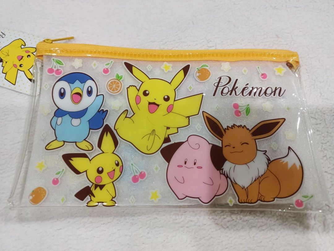 Authentic Pokemon Pikachu Flat Vinyl Zipper Pouch (Category: Character Goods) located in Manila. Submitted by jollynest24 (Listing ID 1468443004, Image 3). Description: - Authentic Pokemon and Friends Flat Vinyl Zipper Pouch - Electric-type designs with Pokéballs - Includes 1 clear pouch featuring Pikachu, Piplup, Eevee, Clefairy, and colorful fruits - Features secure and stylish gold zippers on top of each pouch - Versatile size, great for stori