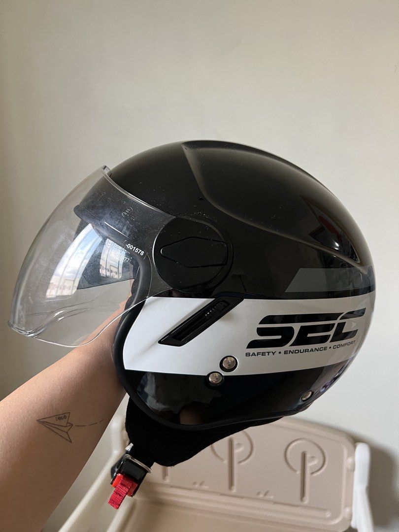 Authentic SEC Half Face Motorcycle Helmet (Category: Helmets and other Riding Gears) located in Pasig City. Submitted by goodjujuonlyyy (Listing ID 1468348869, Image 2). Description: Original SEC Half Face Helmet (Large) - Size L, fits head circumference 59-60 cm - ECE R 22.06 certified with safety stickers at the back - Clear scratch resistant visor attached - Free tinted visor - Free Helmet bag - Used for a month only (less than 5x) - 9/10 cond