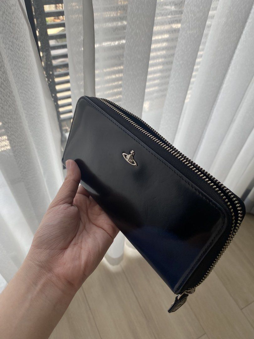 Authentic Vivienne Westwood Wallet (Category: Wallets & Card holders) located in Antipolo. Submitted by c.tokyo (Listing ID 1468322857, Image 2). Description: Bought from japan Guaranteed authentic Issue: theres a bleached part cos of uv exposure, can be fixed with leather conditioner/cream 🤍.